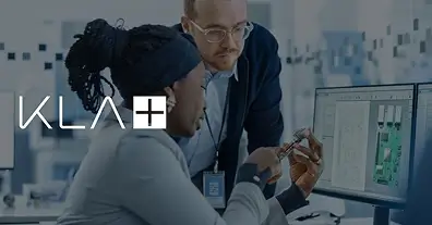 Two people looking at a device together.